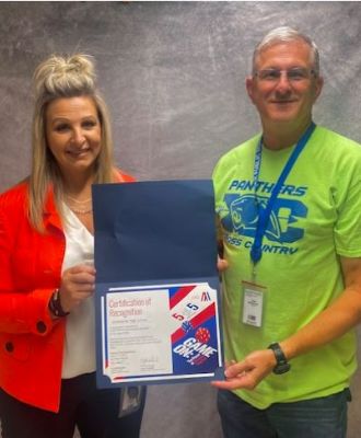  Tobin McCammon & Susan Harmon receiving JAG's 5 for 5 Award.